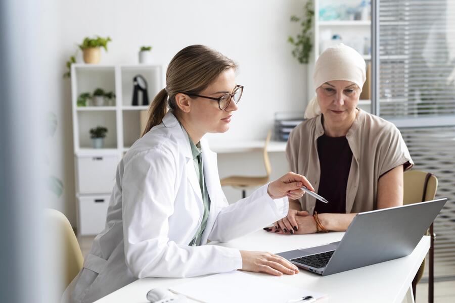 woman-with-skin-cancer-talking-with-doctor.jpg
